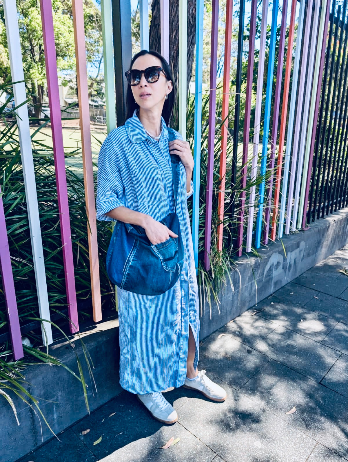 Upcycled edgy denim hobo bag with seam and zipper detail