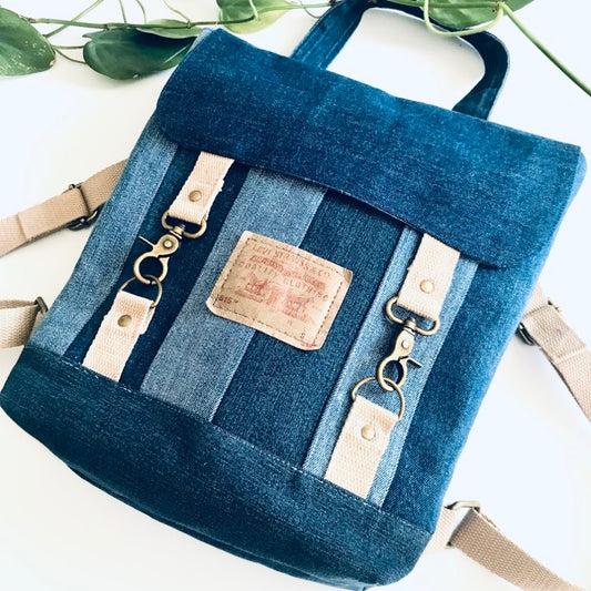Blue denim satchel backpack with checked cotton lining