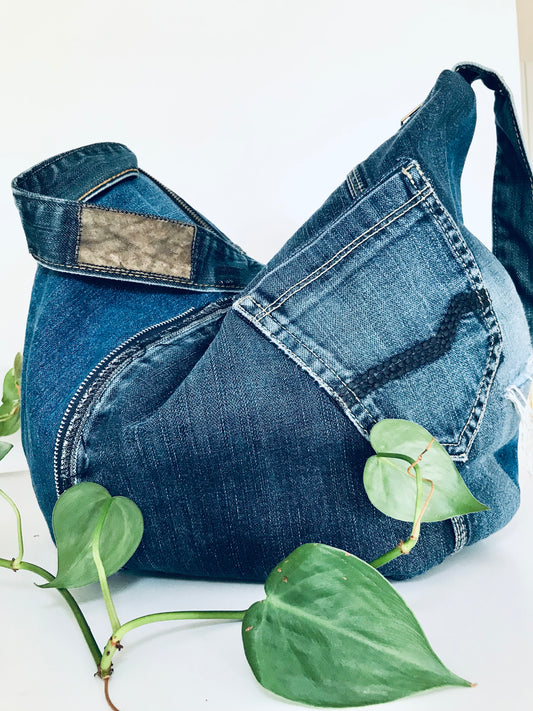 Upcycled edgy denim hobo bag with seam and zipper detail